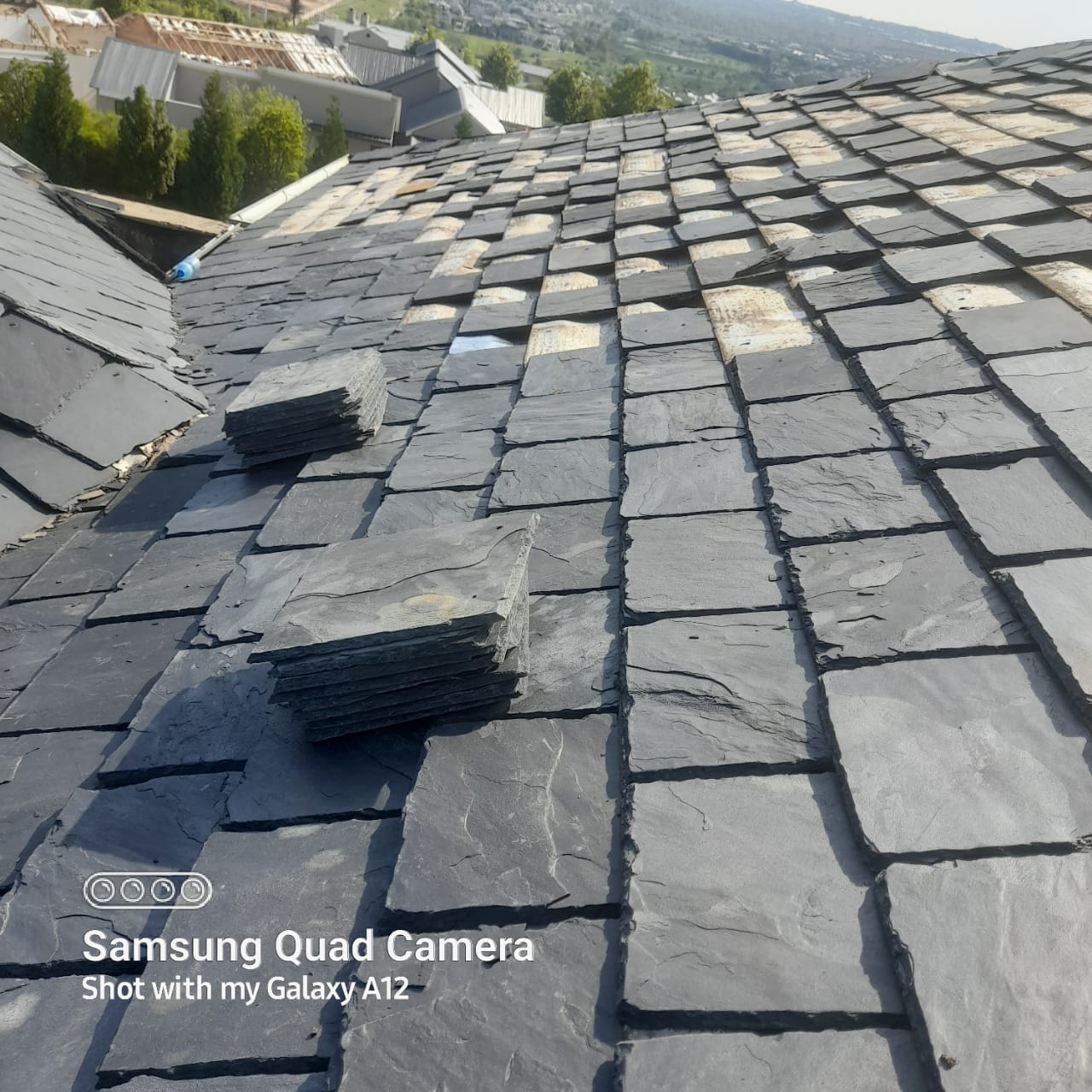 Roof tiles being assessed