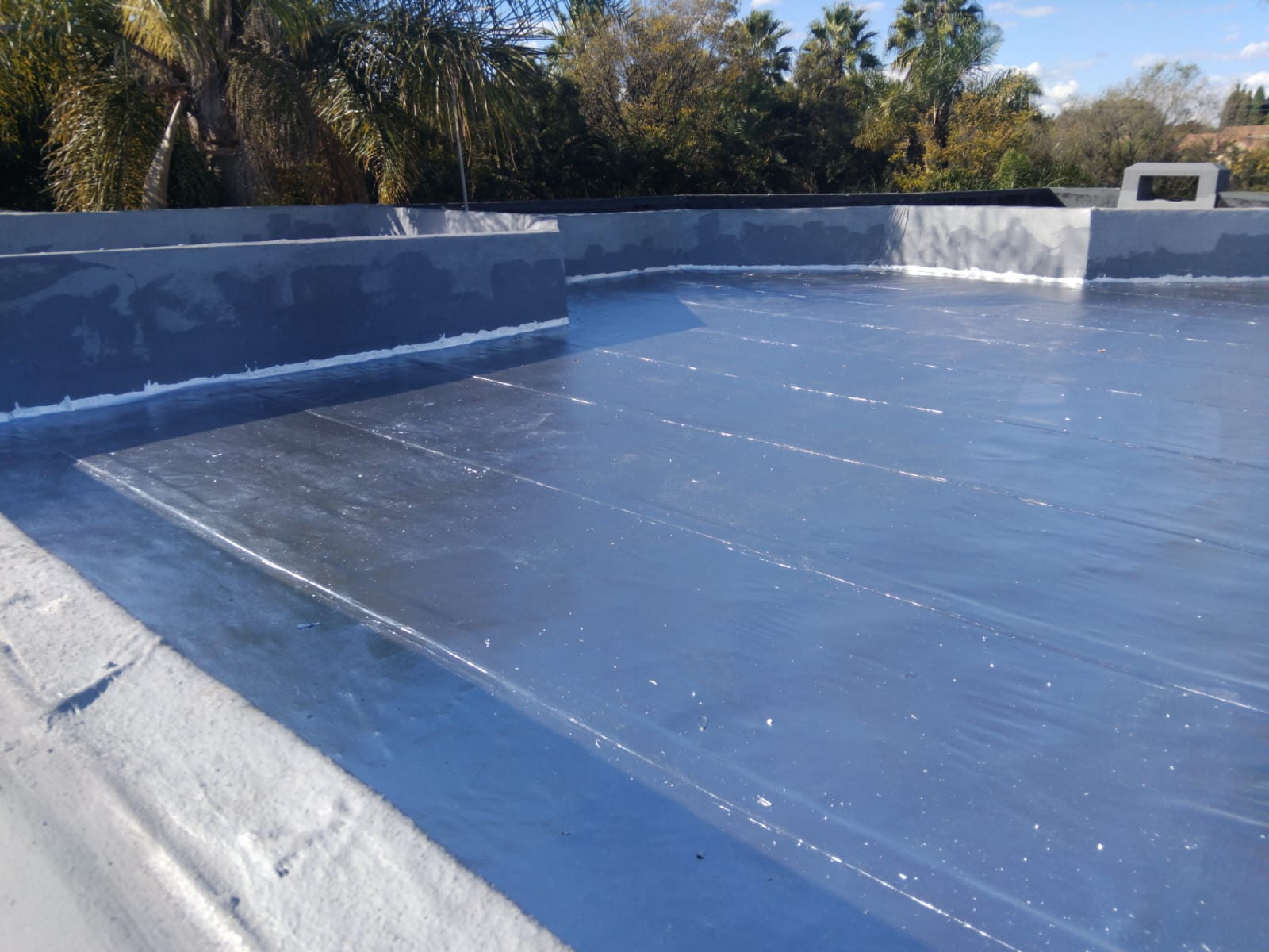Waterproofed flat roof surface